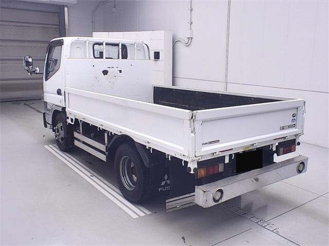 2019 Mitsubishi Fuso Canter 4WD flatbed truck, 2-ton capacity. auction photo 2
